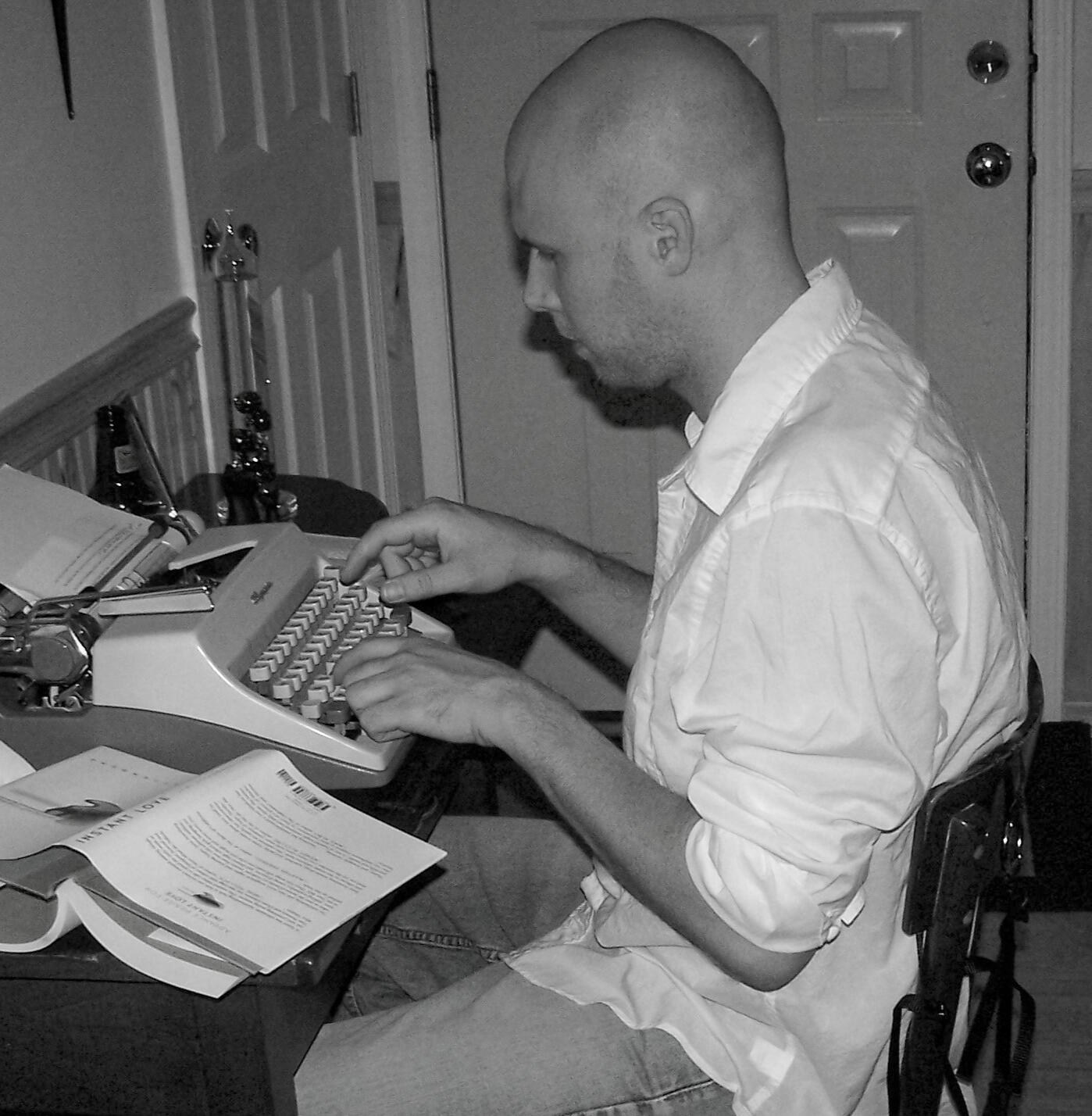 Kevin Keck at work Keck Sitting at Typewriter